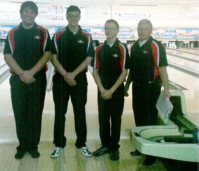 Coldwater bowlers Shawn Johnson, Tyler Newman and Brady Omo are pictured with coach Frank DeMond. LAYNE SOURS PHOTO