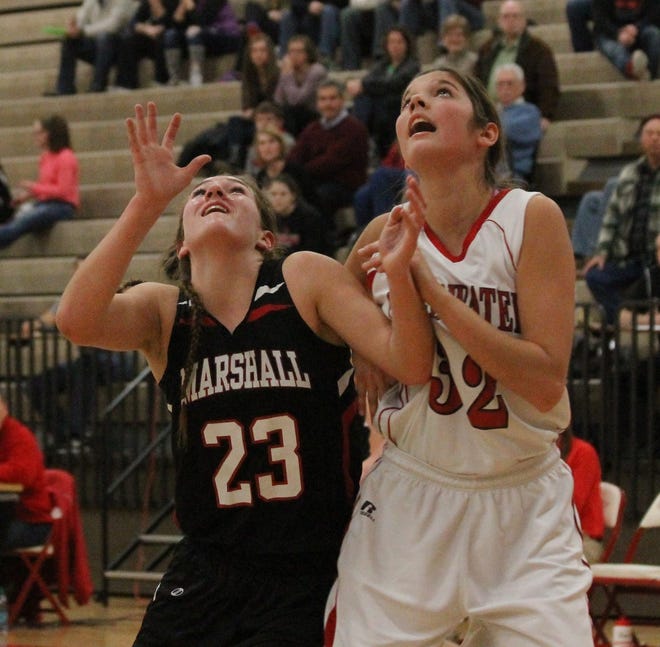 Coldwater's Carlee Smoker looks to grab a rebound over Marshall's Nikki Tucker Friday night.



PHOTO BY TROY TENNYSON