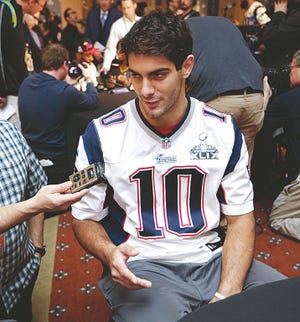 New England Patriots quarterback Jimmy Garoppolo answers questions during a news conference Thursday, Jan. 29, 2015, in Chandler, Ariz. The Patriots play the Seattle Seahawks in NFL football Super Bowl XLIX Sunday, Feb. 1.