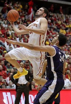 Iowa State forward Georges Niang drives past TCU forward Kenrich Williams during the first half of an NCAA college basketball game, Saturday, Jan. 31, 2015, in Ames, Iowa.
