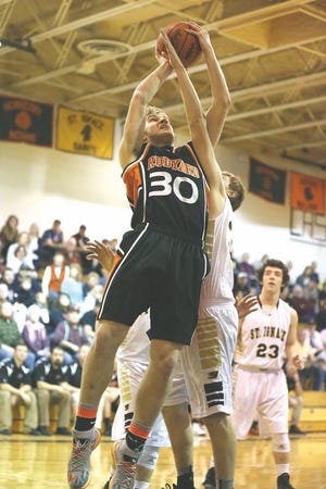 Rudyard’s Owen Mills (30) goes up for a shot against St. Ignace during a Straits Area Conference boys basketball game Friday.