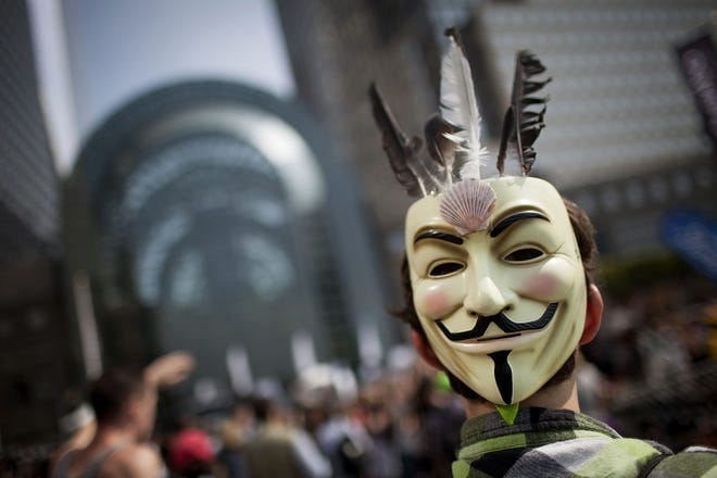 In 1606, Guy Fawkes, convicted of treason for his part in the ''Gunpowder Plot'' against the English Parliament and King James I, was executed. Above, an Occupy Wall Street protester wearing a Guy Fawkes mask demonstrates in New York in 2012.