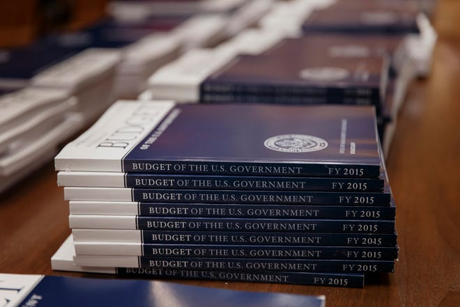 In this March 4, 2014, photo, copies of President Barack Obama's proposed budget for fiscal 2015 are set out for distribution by the Senate Budget Committee, on Capitol Hill in Washington.