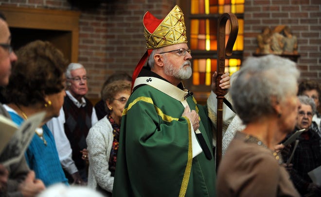 Cardinal Sean Patrick O'Malley of the Roman Catholic Archdiocese of Boston enters the chapel to say Mass for residents of the New Horizons at Marlborough independent and assisted living community. 

Daily News Staff Photo / Allan Jung