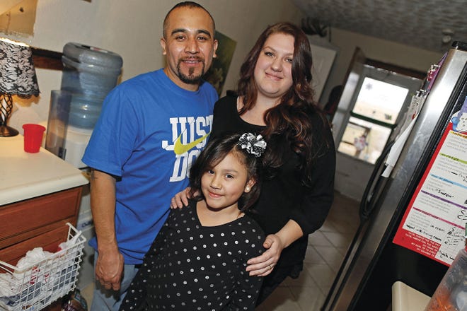 David Zalubowski/Associated Press Maximiano Vazquez-Guevarra, left, his wife, Ashley Bowen, and their 6-year-old daughter, Nevaeh Vazquez, pose for a photo in their home Saturday in the northeast Denver suburb of Commerce City, Colo. The presidential executive order that fast-tracked immigration hearings for last summer's flood of Central American migrants may have had unintended consequences in canceling hearings for non-detained immigrants with longstanding cases.
