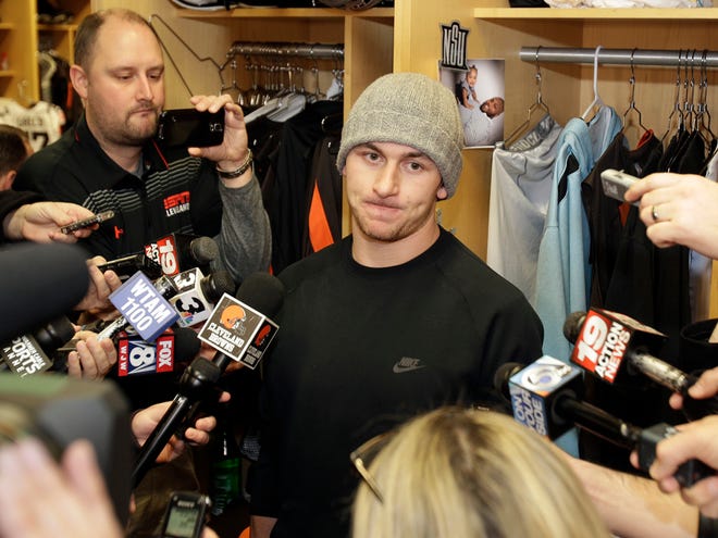 In this Monday, Dec. 29, 2014 file photo, Cleveland Browns quarterback Johnny Manziel talks with the media at the NFL football team's training camp, in Berea, Ohio.
