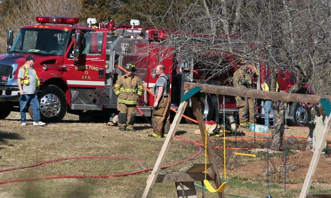(Photo Mike Hensdill/The Gaston Gazette ) Firefighters respond to a house fire on Tot Dellinger Road near Cherryville Tuesday morning, February 3, 2015.