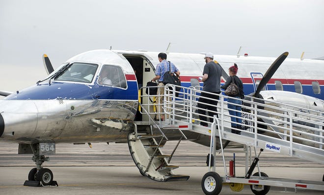 CHIEFTAIN PHOTO/FILE A 30-passenger SkyWest Airlines flight gets ready to depart Pueblo Memorial Airport for Denver International Airport in October. The federal goverment is asking Pueblo to share in the subsidy of the Essential Air Service flights.