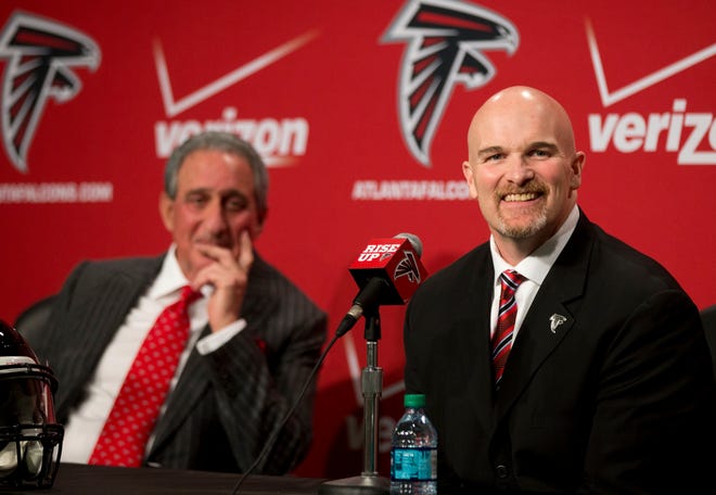 Former Seattle Seahawks defensive coordinator Dan Quinn, right, and Atlanta Falcons owner Arthur Blank laugh as a reporter asks a question during a news conference introducing Quinn as the new head coach of the Atlanta Falcons NFL football team, Tuesday, Feb. 3, 2015, in Flowery Branch, Ga. (AP Photo/John Bazemore) ns Tuesday, Feb. 3, 2015, Ga. (AP Photo/John Bazemore)