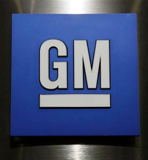 This Jan. 25, 2010, file photo, shows a General Motors Co. logo during a news conference in Detroit. General Motors Co. reports quarterly financial results, Wednesday, Feb. 4, 2015. (AP Photo/Paul Sancya, File)