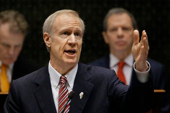 Illinois Gov. Bruce Rauner delivers his State of the State address to a joint session of the General Assembly, Wednesday, Feb. 4, 2015, at the Capitol in Springfield, Ill. (AP Photo/Seth Perlman)