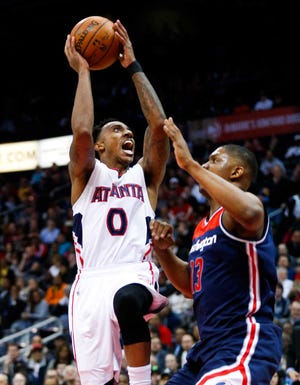 John Bazemore/The Associated PressAtlanta Hawks guard Jeff Teague goes up for a shot against Washington Wizards center Kevin Seraphin during the first half Wednesday in Atlanta.