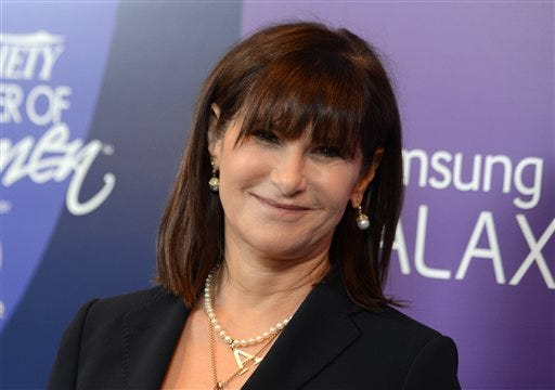 In this Oct. 4, 2013 file photo, Amy Pascal, Sony Pictures Entertainment co-chairman, arrives at Variety's 5th Annual Power of Women event at the Beverly Wilshire Hotel in Beverly Hills, Calif. Sony on Thursday, Feb. 5, 2015 announced that Pascal will step down as co-chairman of Sony Pictures Entertainment and head of the film studio, nearly three months after a massive hack hit the company and revealed embarrassing emails. (Photo by Jordan Strauss/Invision/AP, File)