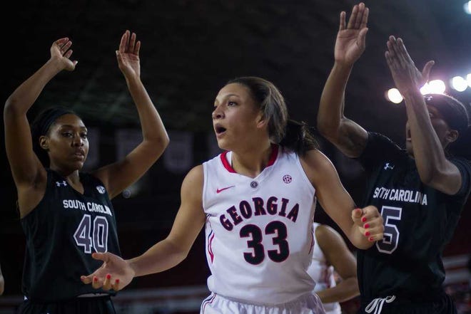 South Carolina forward Jatarie White (40), Georgia forward Mackenzie Engram (33) and South Carolina guard Khadijah Sessions (5) react after a play during the first half of an NCAA college basketball game between Georgia and South Carolina on Thursday, Feb. 5, 2015, in Athens, Ga. (AJ Reynolds/Staff, @ajreynoldsphoto)