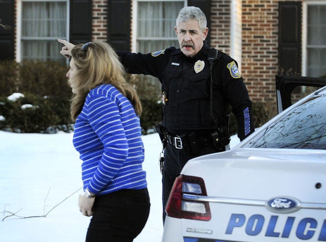 Buckingham police direct Carla Risoldi when she arrives at the scene of a reported suicide on Danielle Drive Thursday, Feb. 5, 2015.