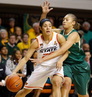 Oklahoma State's Brittney Martin (22) tries to get [ast Baylor's Alexis Prince (12) during a women's college basketball game between the Oklahoma State University Cowgirls (OSU) and the University of Baylor Lady Bears at Gallagher-Iba Arena in Stillwater, Okla.,Wednesday, Feb. 4, 2015. Photo by Bryan Terry, The Oklahoman