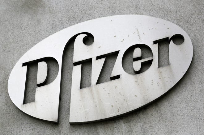 FILE - In this May 4, 2014 file photo, the Pfizer logo is displayed on the exterior of a former Pfizer factory in the Brooklyn borough of New York. Pfizer is buying Hospira for approximately $15.23 billion, saying it is a good fit with its global established pharmaceutical business. Hospira Inc., based in Lake Forest, Illinois, is a provider of injectable drugs and infusion technologies. Pfizer said Thursday, Feb. 5, 2015 that it will use its global network to help expand Hospira’s reach to Europe and key emerging markets. (AP Photo/Mark Lennihan)