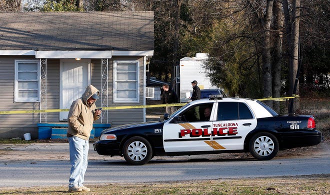 Homicide investigators work the scene of a shooting on 40th Street near 6th Ave. The victim suffered a gunshot wound on Thursday Feb. 5, 2015 in Tuscaloosa, Ala. staff photo | Robert Sutton