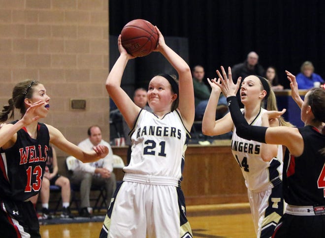 Traip Academy’s Carly Patterson snatches a rebound during Thursday’s game against Wells in Kittery, Maine.