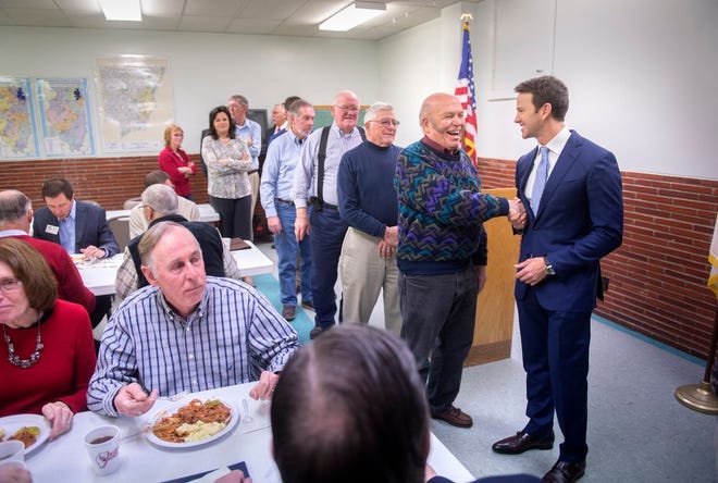 Ted Harding of Trivoli, left, greets U.S. Rep. Aaron Schock as returns to Peoria to speak to the Peoria County Farm Bureau after a tumultuous week where his top aide Benjamin Cole resigned and Schock's office decoration design became a national story.