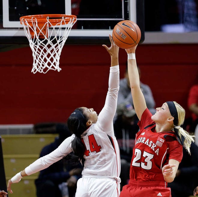 Nebraska forward Emily Cady (23) shoots as Rutgers forward Betnijah Laney (44) defends during the first half of an NCAA college basketball game Thursday, Feb. 5, 2015, in Piscataway, N.J. (AP Photo/Mel Evans)