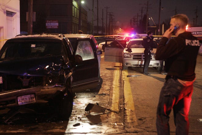 Vehicles involved in an accident that ended a high-speed chase sit Jan. 28, 2011, on Ninth Street near Harrison Avenue in Rockford. On Thursday, Feb. 5, 2015, the driver of the car involved in the chase, Cornelius Boles, was sentenced to 30 years in prison. RRSTAR.COM FILE PHOTO