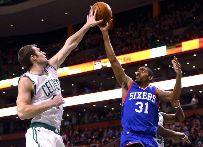 The 76ers' Hollis Thompson has his shot blocked by the Celtics' Tyler Zeller during the first quarter in Boston on Friday. Winslow Townson/THE ASSOCIATED PRESS