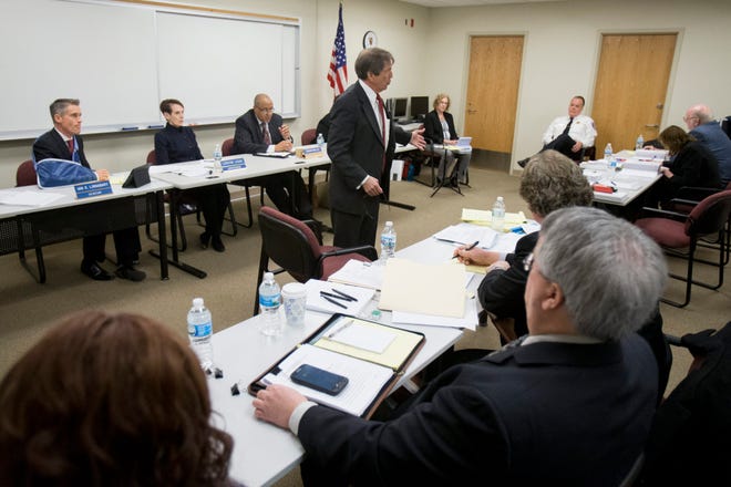 Attorney Dan Cain questions Rockford Police Chief Chet Epperson during a hearing Monday, Jan. 26, 2015, with the Board of Fire and Police Commissioners at the Fire Department headquarters in Rockford.