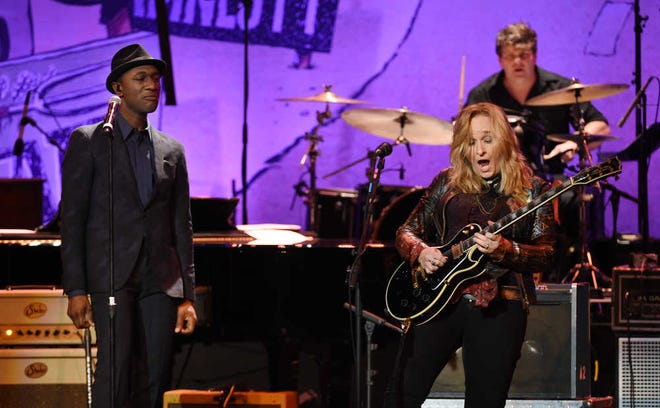Aloe Blacc, left, and Melissa Etheridge perform together at the 17th Annual Grammy Foundation Legacy Concert at the Wilshire Ebell Theatre on Thursday in Los Angeles.