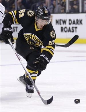 Bruins left wing Brad Marchand (63) wasn't bothered by a trip from the Islanders' John Tavares that some thought might have been slew footing. AP Photo/Charles Krupa