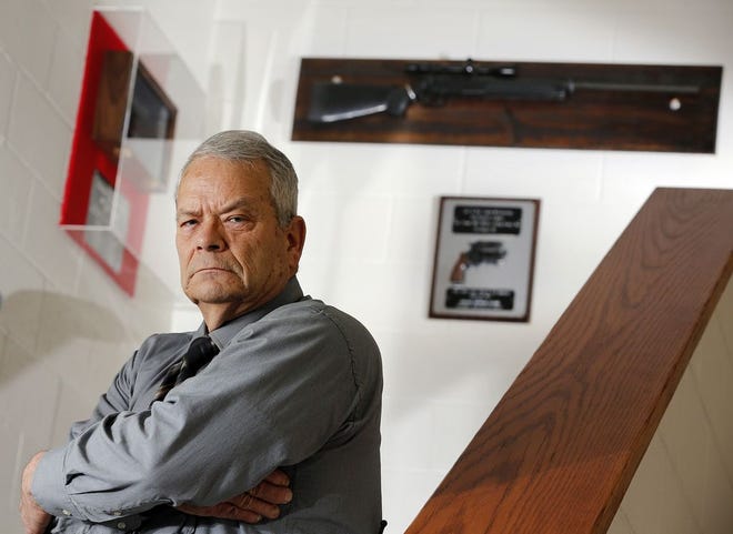 Former CPD sniper Michael Plumb poses at the S.W.A.T. headquarters where his Austrian-made Steyr SSG PII black sniper rifle and the .38-caliber pistol he targeted are on display on Thursday, Jan. 29, 2015. twenty-two years ago, Mike Plumb shot a .38 caliber pistol out of the hand of Doug Conley, who was in a standoff with police, threatening to kill himself. We tracked down Conley, talked with Plumb about that day and see what Plumb is doing now.