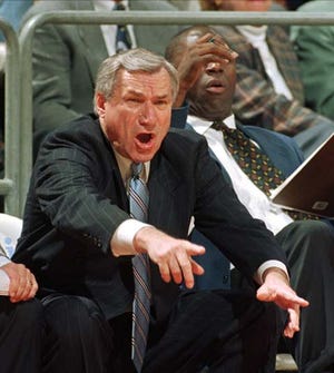 In a Jan. 22, 1997 file photo, North Carolina head coach Dean Smith yells at his players during ACC basketball action against Florida State in Tallahassee, Fla. Smith, the North Carolina basketball coaching great who won two national championships, died “peacefully” at his home Saturday night, the school said in a statement Sunday from Smith's family. He was 83.