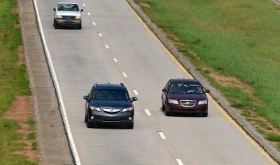Traffic moves along the 10 Loop as Georgia State Troopers watch for slow drivers in the passing lane in Athens, Ga. on Thursday, July 25, 2014.   (Richard Hamm/Staff) OnlineAthens / Athens Banner-Herald
