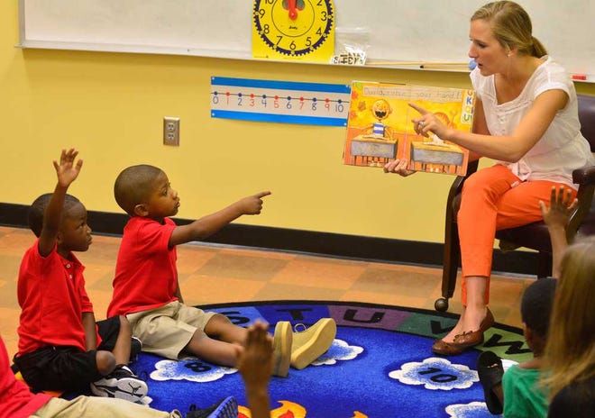 Kara Lee Pifer reads a story to her kindergarden class during the first day of school at the Downtown Academy on Wednesday, 7, 2013, in Athens, Ga.   (Richard Hamm/Staff) OnlineAthens / Athens Banner-Herald