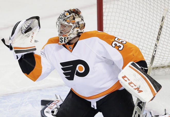 Flyers goalie Steve Mason stops a shot against the Sharks during a game on Tuesday, December 2, 2014 in San Jose, California.
