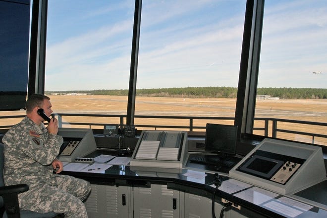 Sgt. Jeffrey Baehr, a Louisiana National Guard air traffic controller, observes a plane taking off from the newly constructed air traffic control tower at Hammond Northshore Regional Airport, Dec. 17, 2014. The National Guard's 1-244th Air Assault Helicopter Battalion and 204th Theater Air Operation Group are based at the airport. Army and Air National Guardsmen staff the control tower, enhancing safety at the airport and allowing a wider range of civilian and military aircraft to use the facility. (U.S. Army National Guard photo by Spc. Joshua Barnett, Louisiana National Guard Public Affairs Office/Released)
