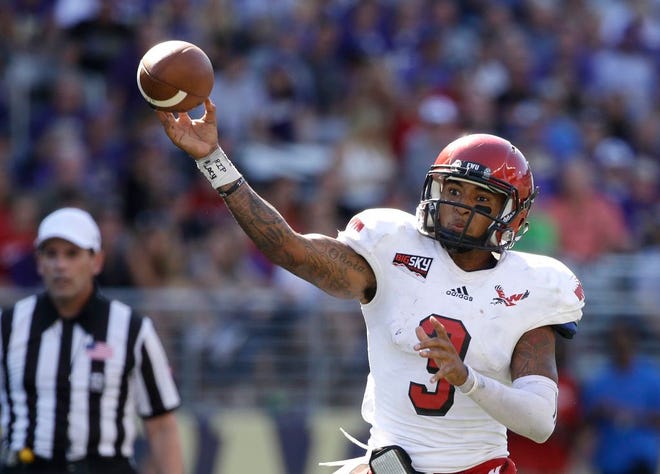 In this Sept. 6, 2014, file photo, Eastern Washington quarterback Vernon Adams Jr. throws a pass against Washington Huskies in the second half of an NCAA college football game in Seattle. Eastern Washington quarterback Vernon Adams, an FCS All-American, says he will transfer to Oregon where he will be eligible to play next season and compete to replace Marcus Mariota.