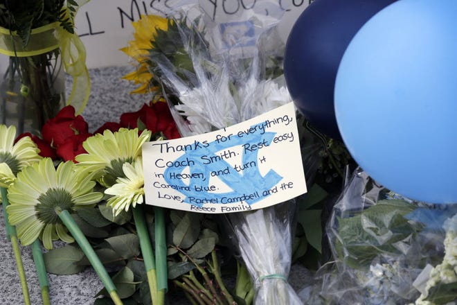 A note rests among flowers and other offerings at a memorial for former North Carolina basketball coach Dean Smith at the Dean E. Smith Center in Chapel Hill, N.C., Monday, Feb. 9. Smith died at his home Saturday night, Feb. 7, 2015. 



AP /Gerry Broome