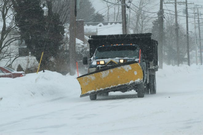 A plow on Grassy Plain Road in East Providence on Feb. 9, 2015.