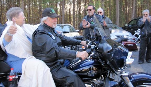 Several local biker organizations recently came together to help make a wish come true for Hospice patient, Caroline McAlister. Skip Hollifiled took her for a ride on his motorcycle. Photo submitted by Hospice
