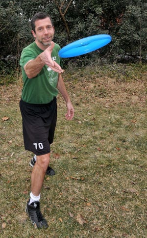 Ed Cohen, 54, practices a throw in his backyard in Mount Laurel.