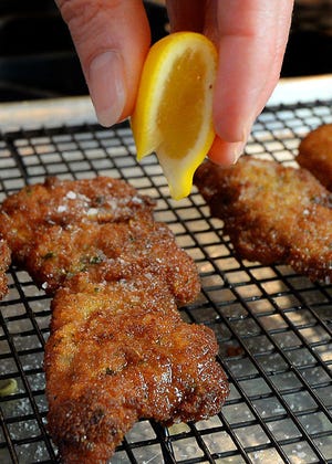 Squeeze fresh lemon onto the Veal Milanese before serving.