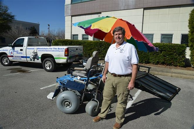 Morris Padgett offers two beach wheelchair models for rent, shown here are the beach push chair in the foreground and the Beach Cruiser in the background.