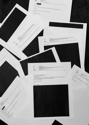 Pictured at left are some of the redacted emails from Brownback staffers to lobbyists.