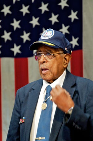Tuskegee Airman Virgil Poole talks to a crowd at Veterans Memorial Hall in 2013. Several Tuskegee Airmen will return to Veterans Memorial Hall on Feb. 21, 2015. RRSTAR.COM FILE PHOTO