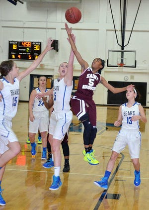 PETER.WILLOTT@STAUGUSTINE.COM St. Augustine High School's Leandra Franklin (5) blocks Bartram Trail High School's Kirsten Clement (5) from scoring in the second quarter of their Region 1-6A semifinal game at Bartram on Tuesday, February 10, 2015.