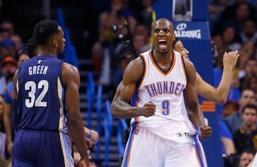 Oklahoma City Thunder forward Serge Ibaka (9) pumps his fist and screams during the second quarter of an NBA basketball game against the Memphis Grizzlies in Oklahoma City, Wednesday, Feb. 11, 2015. Grizzlies forward Jeff Green is at left. Oklahoma City won 105-89.