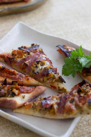 Alison Ladman combines pizza and muffaletta in her flatbread recipe.
