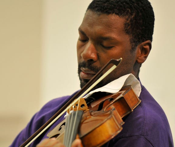 Violinist Amadi Azikiwe has performed and conducted at major venues throughout the world.