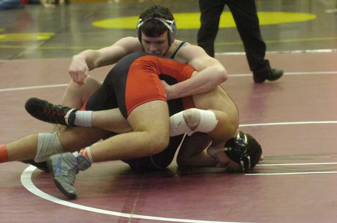 Rossville's Isaac Luellen, top, is one of several Bulldawg wrestlers who have battled injuries this season.